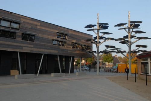 A nursery yard with decorative vertical-axis windturbines